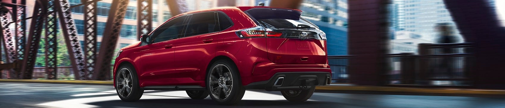 Ford Explorer driving over a city bridge